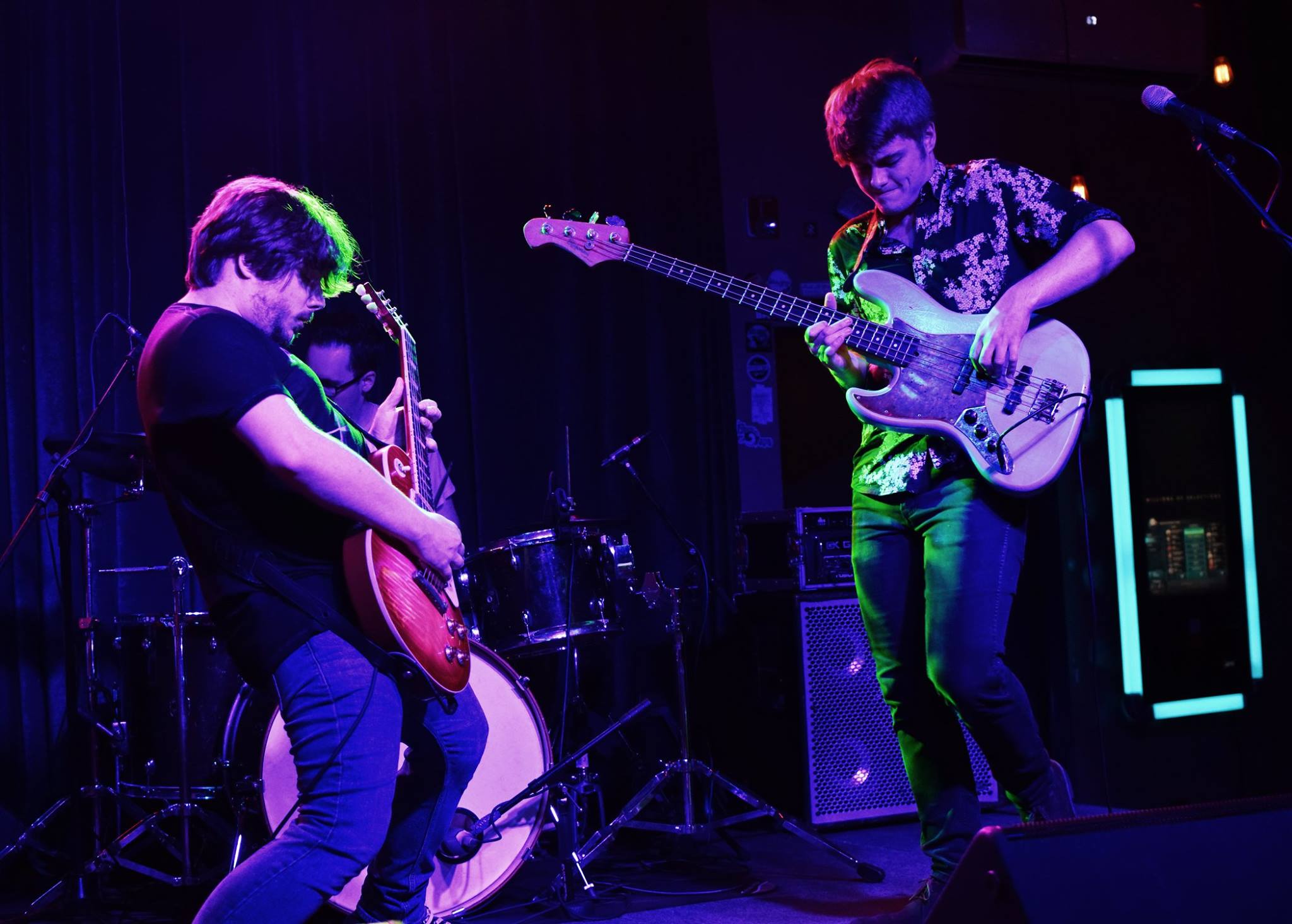 Individually Twisted performing at Barrelhouse South in purple and green lighting