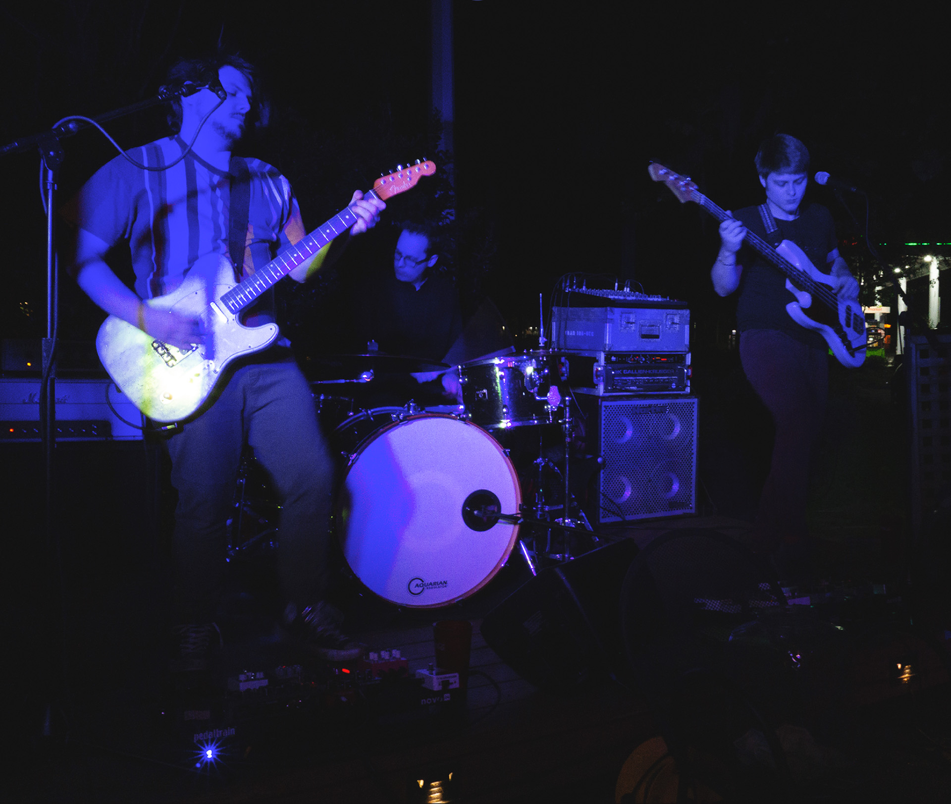 Individually Twisted performing at Basil's at night